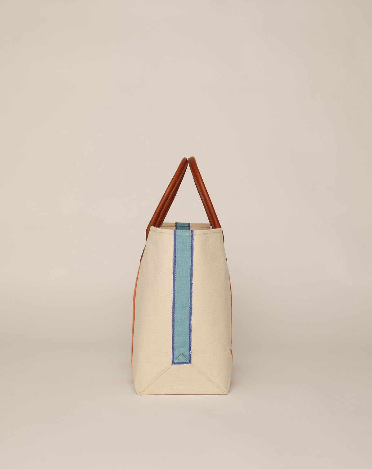 Profile image of classic canvas tote bag in natural ecru colour with leather handles and contrasting orange stripes.