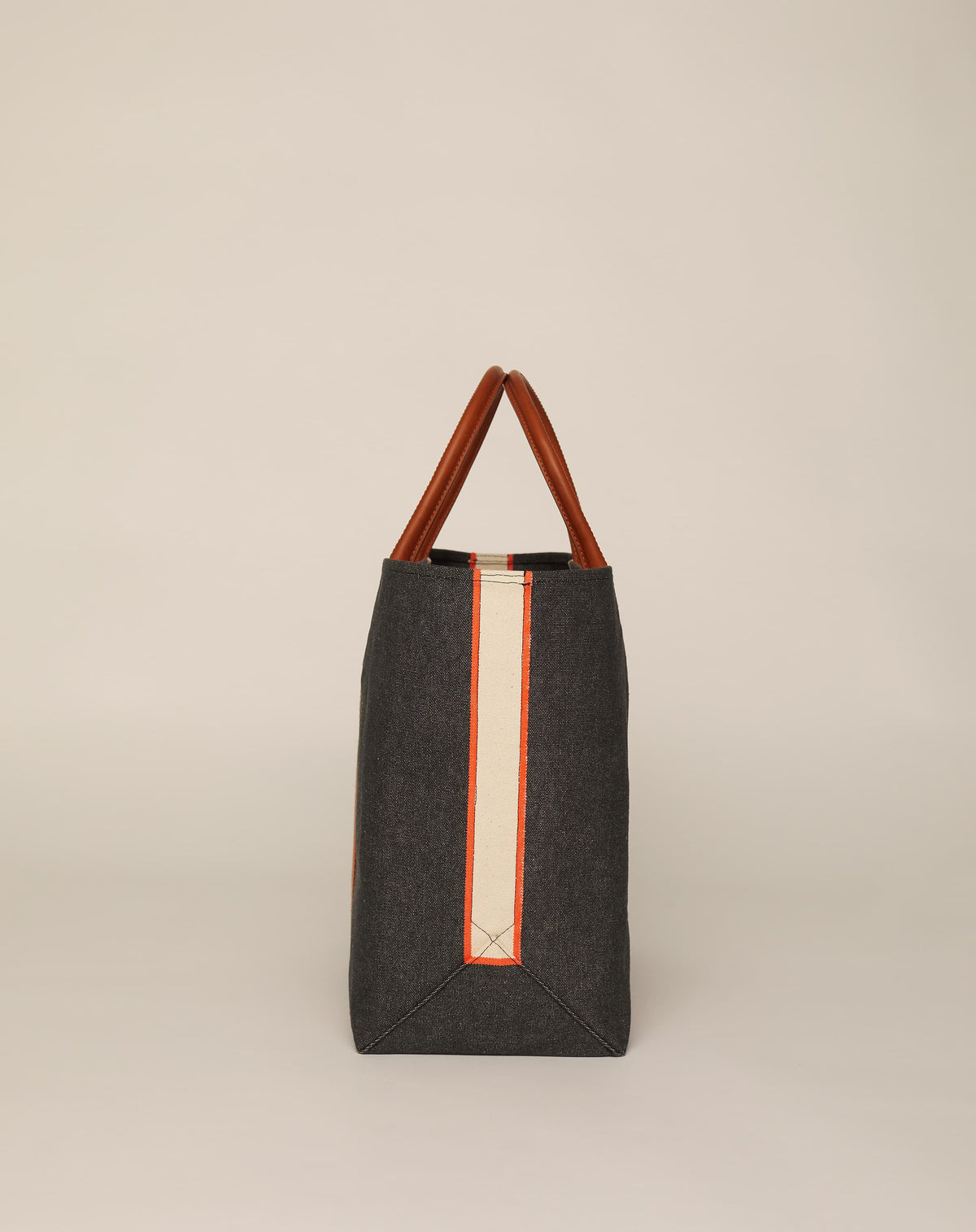 Profile image of classic canvas tote bag in washed black colour with tan leather handles and contrasting stripes.