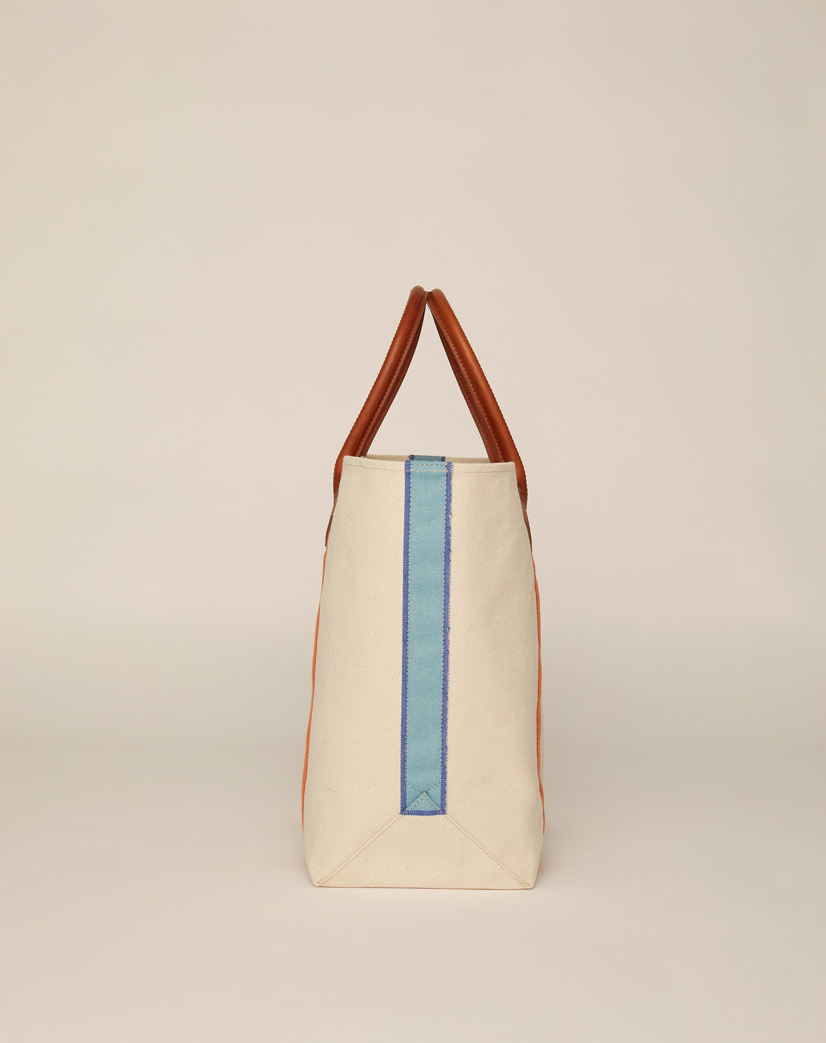 Profile image of medium-sized classic canvas tote bag in natural ecru colour with tan leather handles and contrasting stripes.
