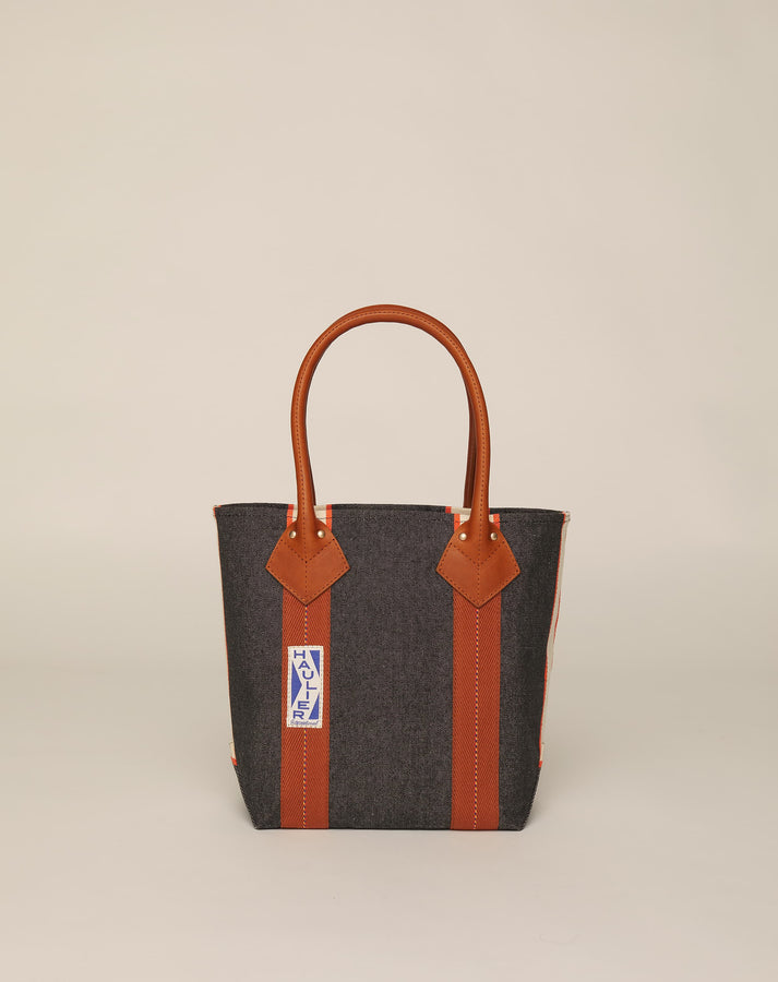 Image of small classic canvas tote bag in washed black colour with tan leather handles and contrasting stripes.